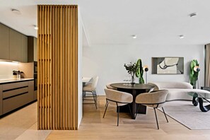 Dine in style beside our chic wooden partition, blending art with architecture.