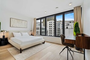 Wake up to inspiring city views in a room that defines modern comfort.