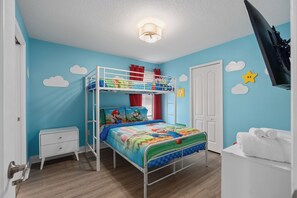 Mario themed bedroom with a twin over full bed and 50" TV