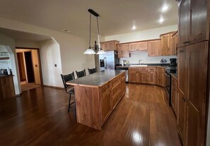 Kitchen has ample cupboard and pantry space. 