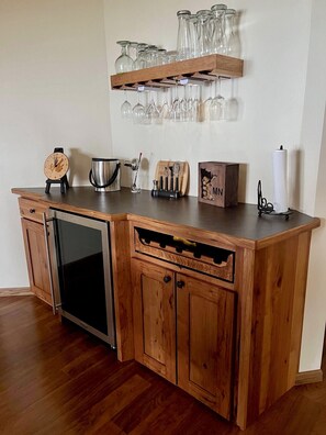 Wine bar and fridge keeps beverages handy to patio and table.