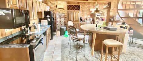 Kitchen area-please note high top sitting bar has been replaced with new bar
