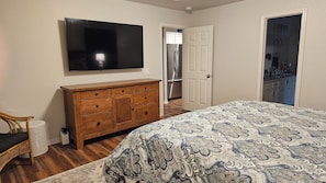 Large Smart TV in Master Bedroom