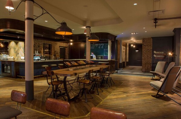 Hotel Old 77's dining area boasting eclectic seating and warm, ambient lighting