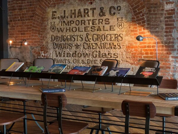 Historic character shines through in Hotel Old 77's lobby with brick walls and antique decor