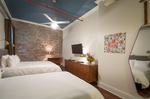 Urban tranquility highlighted by modern art in a restful bedroom