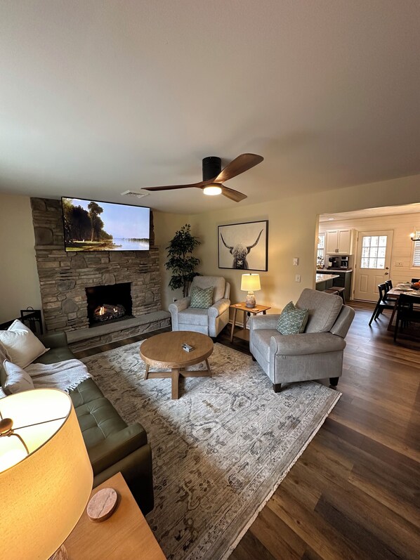 65” smart tv, gas fire place, leather couch, power reclining chairs. 