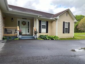 Front Door of Cottage has Paved Parking for easy load/unload.
Birds singing

 
