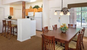 two-bedroom-dining-kitchen-664x386_enhanced