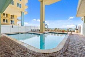 Take a dip in the beachfront pool, complete with lounge chairs and stunning Gulf views just steps away.