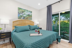 Master Bedroom With Private Balcony, King Bed, TV, and Private Bathroom with Toilet, Double Vanity, Walk in shower, High end  Designer Tile and Shower Glass Enclosure. Plush High End Luxe Bedding and Furniture.. 