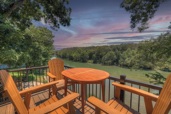 You will love sitting out on the private patio lookin at the Amazing Views of our beautiful River! Up in the Treehouse River Cabin! The patio seating areas with comfortable and inviting spaces for relaxation and entertainment, allowing guests to enjoy the beautiful outdoor surroundings and river views.