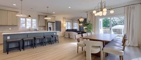 Open concept kitchen, dining room and living room