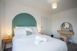 Our adorned with beautiful beddings and plush pillows, fading lights and side chair, each bed is a haven of comfort, promising sweet dreams and rejuvenation.