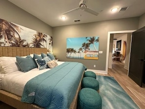 A king-sized bed and tropical decor to enhance your beachside getaway.