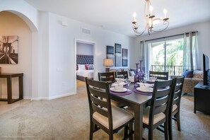 Charming living and dining area of the condo in Orlando Florida - 6 Persons dining - Open-concept living area seamlessly connected to a stylish dining space - Stylish furniture arrangement providing comfort and a cohesive look