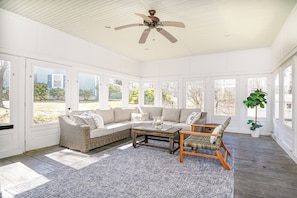 Bask in the sunlight and serenity of our enclosed back patio