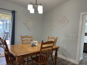 Dinning area table with leaf for expanded seating.