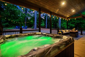 Hot Tub Oasis: Unwind under twinkling lights, surrounded by nature's beauty and soothing waters!