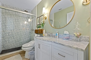 Wash the sand from your toes in the main, ensuite, bathroom featuring a refreshing walk-in shower.