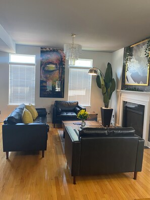 Living room seats 5 comfortably. Nice soft vegan leather sofa and chairs