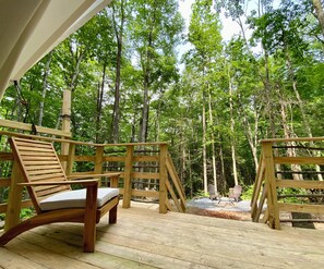 The attached deck offers comfortable seating to relax and enjoy the forest.  