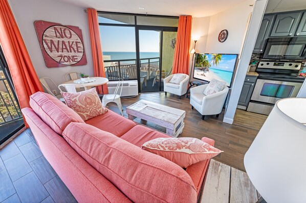 - Cozy living room with warm decor and plenty of natural light, open layout makes it perfect for relaxing - Comfortable seating, stylish touches, and a seamless indoor outdoor feel - Step onto the balcony for fresh air and stunning ocean views