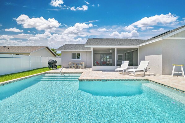 Azul - Enjoy the beautiful Florida weather in this 3 bed / 2 bath pool home with activities for the whole family, including a pool on the patio, cornhole set, fire pit lounge area, and a custom outdoor bar (currently being built - anticipated completion of Summer 2024
