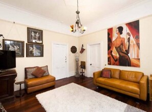 Spacious living room area with separate Aircon for this living area for your comfort.