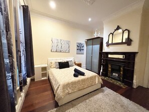 Spacious bedroom with queen bed. Note there is a separate Aircon in this room for your comfort.  Large wardrobe for your stay.