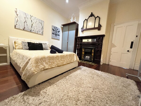 Spacious bedroom with queen bed. Note there is a separate Aircon in this room for your comfort.  Large wardrobe for your stay.