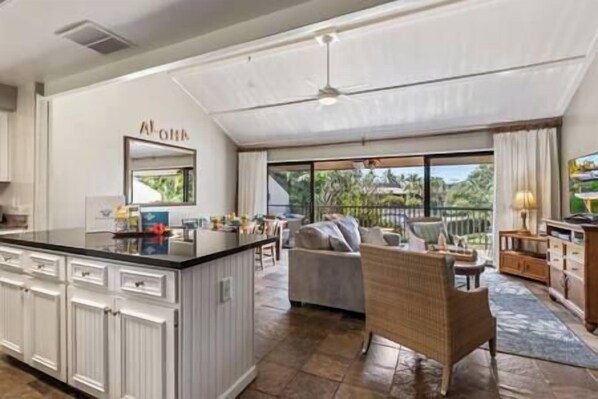 Open floor plan with spacious living area and kitchen
