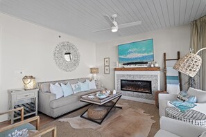 Cozy up on the Queen Size Sleeper Sofa in front of the fireplace and the 65" Smart TV with Sound Bar