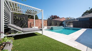 Missy's Escape Resort-style Poolside Daybed by the Pool and Spa