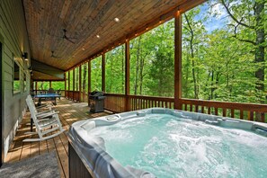 Wilderness Escape: Immerse yourself in relaxation as you soak under the forest sky
