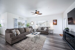 Front house living room with deck and rooftop access