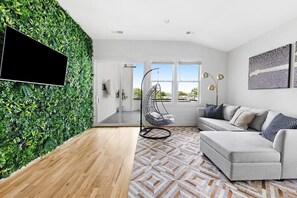 Chic upstairs hangout with garden wall and natural views.