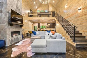 Gather around the fireplace in our spacious living room for some quality family time, cozy conversations, and memorable moments.