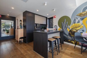 The kitchen comes well-equipped for your holiday catering with sleek appliances and cooking utensils.
