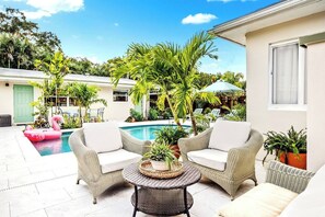 The outdoor lounge area, where you can sit and relax by the pool.