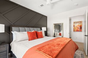 1st Bedroom with king size bed, smart Tv, and bed side tables with drawers for your belongings
