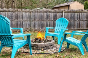 Fire pit with Adirondack chairs