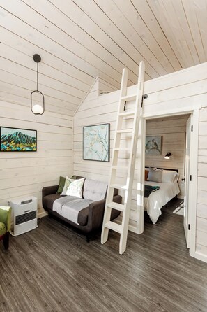 Tiny cabin studio layout living area.