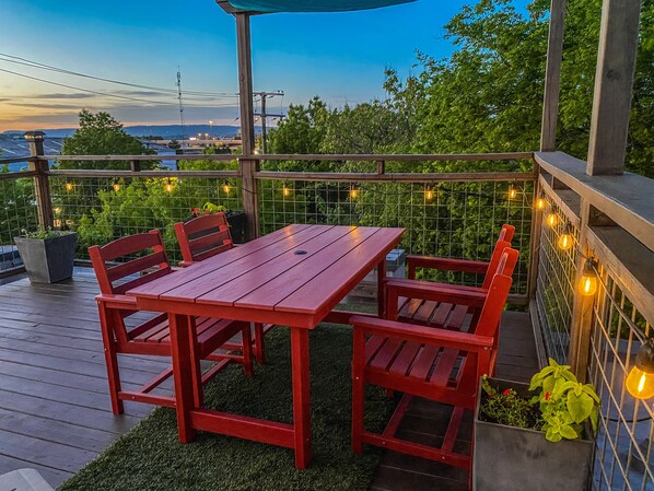 Rooftop table at night with lights