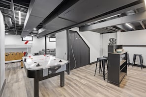 Basement with Game Room | Large Smart TV | Bar Area for Adults