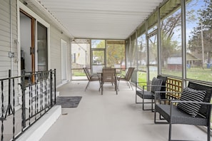 Closed Porch in Backyard with Outdoor Dinning and Seating Area for relaxation