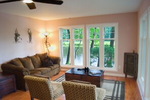 Our living room offers front-row seats to serene waterside views.