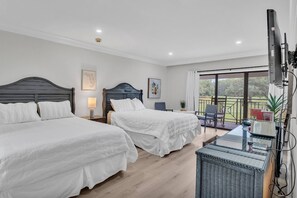 Experience a serene room with large windows overlooking lush green fairways merging with the alluring golf course!