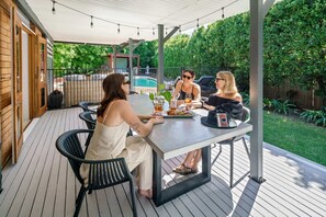 Grab your coffee or your wine and enjoy the sun in this under covered patio downstairs