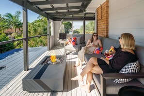 Grab your coffee or your wine and enjoy the sun in this under covered balcony upstairs